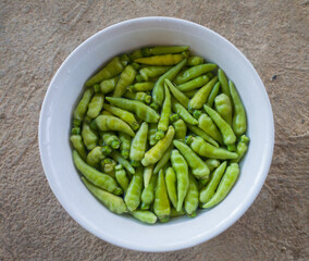Green chilies before eating must be washed in water to remove dirt and pesticides