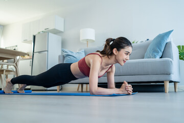 Asian Beautiful young woman stay home, doing cardio exercise at home. 