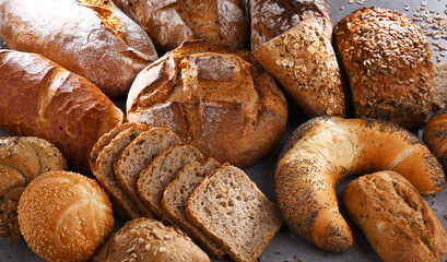 Assorted bakery products including loafs of bread and rolls