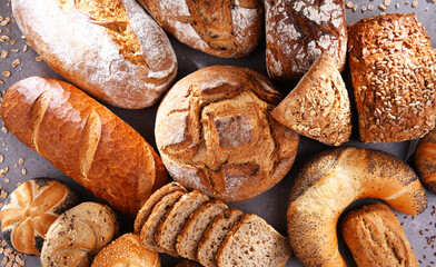 Assorted bakery products including loafs of bread and rolls
