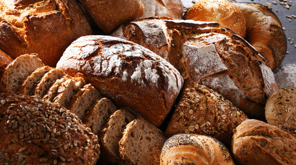 Assorted bakery products including loafs of bread and rolls