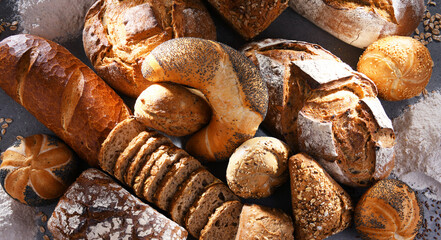 Assorted bakery products including loafs of bread and rolls