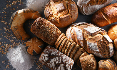 Assorted bakery products including loafs of bread and rolls