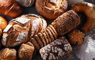 Assorted bakery products including loafs of bread and rolls