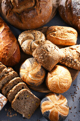 Assorted bakery products including loafs of bread and rolls