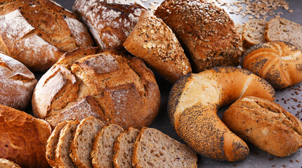 Fototapeta na wymiar Assorted bakery products including loafs of bread and rolls