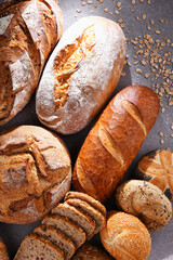 Assorted bakery products including loafs of bread and rolls