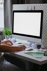 Man freelancer working with computer at home office.