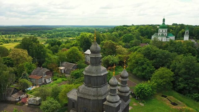 Rural landscape flying around the old wooden church.