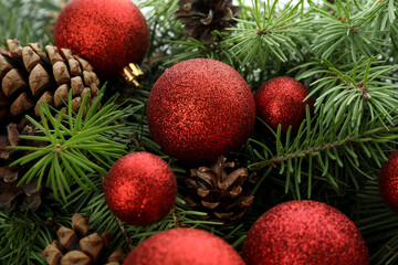 Spruce branches with cones and baubles, close up