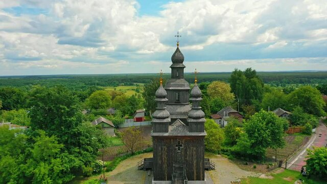 Rural landscape flying around the old wooden church.
