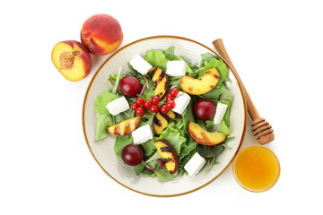 Salad with grilled peach isolated on white background
