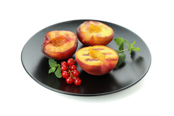 Plate with grilled peach isolated on white background