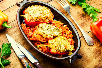 Stuffed peppers with meat on wooden background