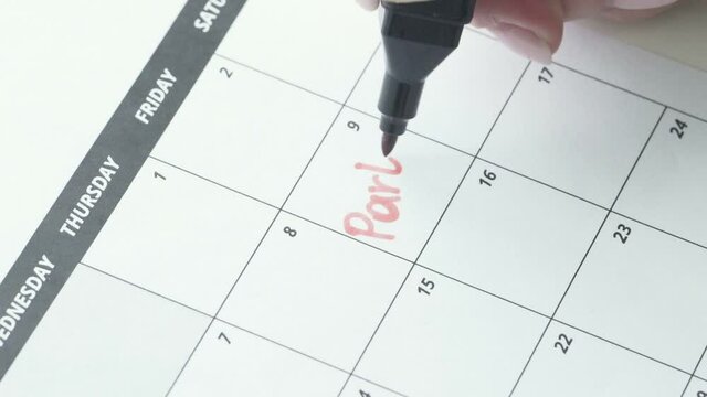 The word party is written in red pen in the calendar close-up