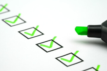 Green marking on checklist box with green pen, Checklist concept