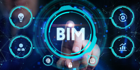 The concept of business, technology, the Internet and the network. A young entrepreneur working on a virtual screen of the future and sees the inscription: BIM