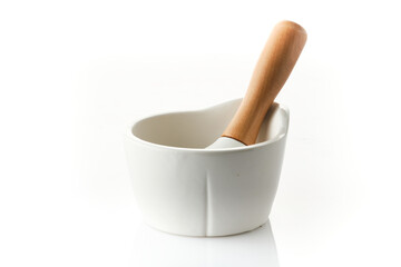 White mortar and pestles with wooden handle  isolated on white background.