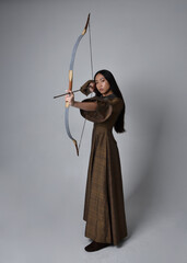 Close up  portrait of beautiful young asian woman with long hair wearing medieval fantasy gown....