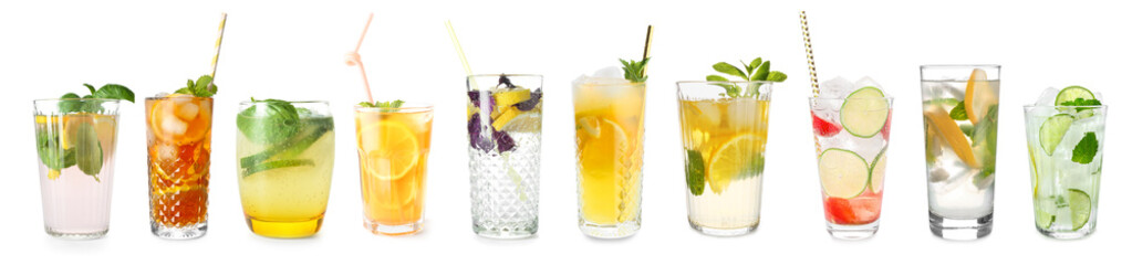 Glasses of tasty cold lemonade with basil on white background