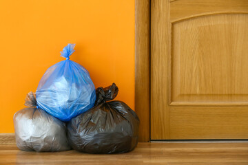 Bags with garbage near door
