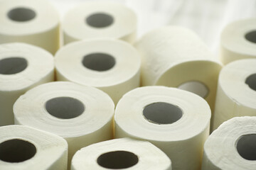 Toilet paper in a roll. Snow-white soft three-layer toilet paper. Lack of hygiene products. Primary protection and disinfection.