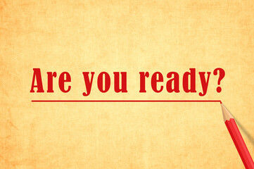 Are You ready Question Written In Yellow Paper Vintage. Red pencil interline The Message on Grungy texture paper background . Motivation Questions concept 