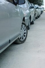 Fototapeta na wymiar Rows of cars parked on the side of the road in a residential are