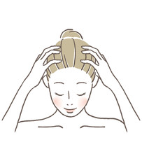 頭をマッサージする女性