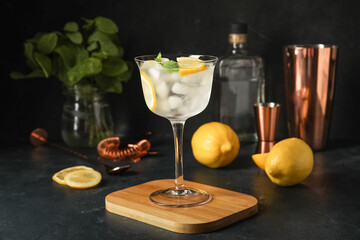 Glass of cold gin and tonic on dark background