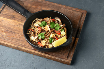 Fried pig ears with sesame seeds and green onions close-up. Fried pig ears in korean style.