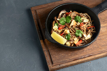 Fried pig ears with sesame seeds and green onions close-up. Fried pig ears in korean style.