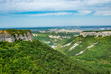 Crimean mountains of the Mangup Plateau with a view of the lake at the foot