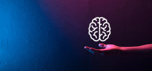 Male hand holding brain icon on neon red,blue background. Artificial intelligence Machine Learning...
