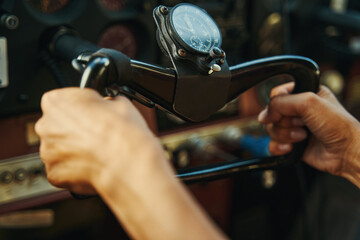 Close up of female hands holding control column