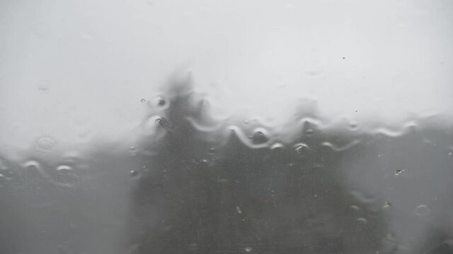 Raining rain on window sad gray day