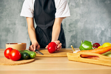 housewife on the kitchen cutting vegetables salad diet