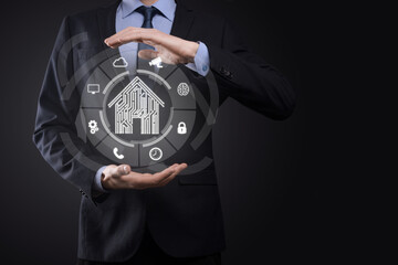 Businessman hold house icon.Smart home controlled, intelligent house, and home automation app concept.Pcb design and person with smart phone. Innovation technology internet Network Concept.