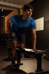 black latino man works out at the gym