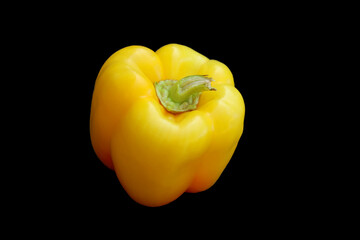 Yellow bell pepper isolated on black