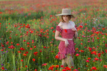 A girl in a poppy field.