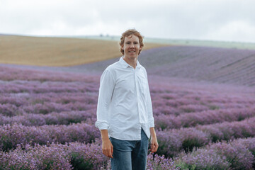 A man in a white shirt in a lavender field