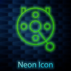 Glowing neon line Spinning reel for fishing icon isolated on brick wall background. Fishing coil. Fishing tackle. Vector