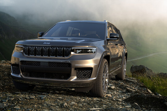 New Jeep Grand Cherokee L on the background of a beautiful mountain landscape