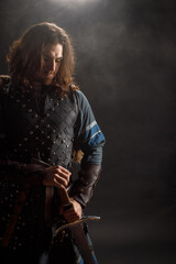 Medieval knight with sword in armor as style Game of Thrones