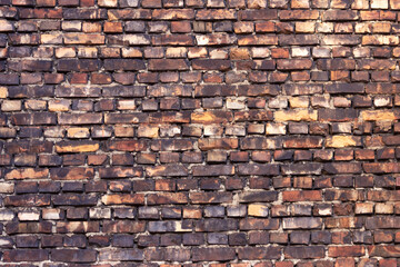 A brick wall in an old house. The texture of aged brickwork.