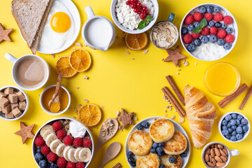 The continental breakfast is captured from above, top view. Coffee, croissants, granola, Belgian waffles, honey, jam. Layout with free text space, copy space