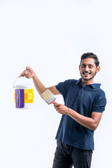 Young indian Painter man over white background.