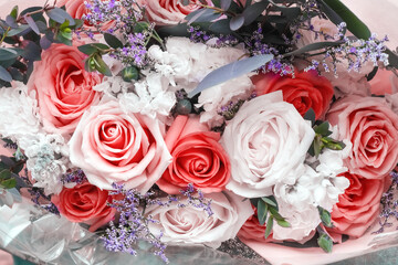 Colorful rose bouquet decorative with gypsophila , top view gift background