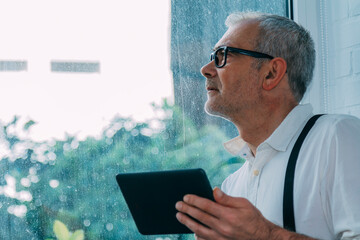 hipster man with tablet at home or office